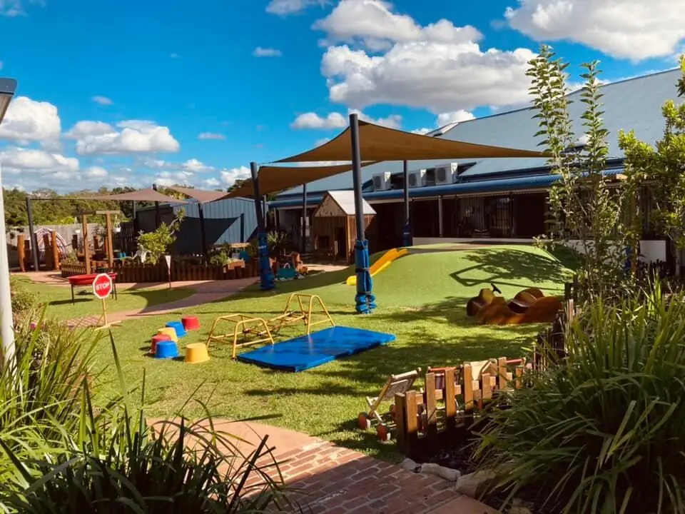 Children exploring the native garden and outdoor learning spaces